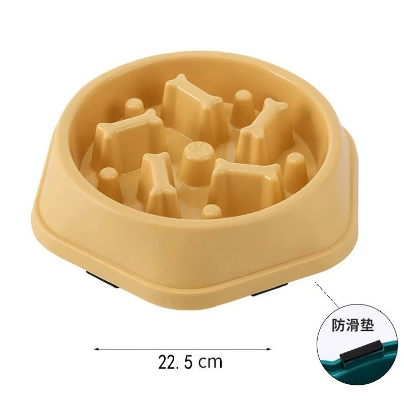 Beige slow feed dog bowl with raised sections on a white background