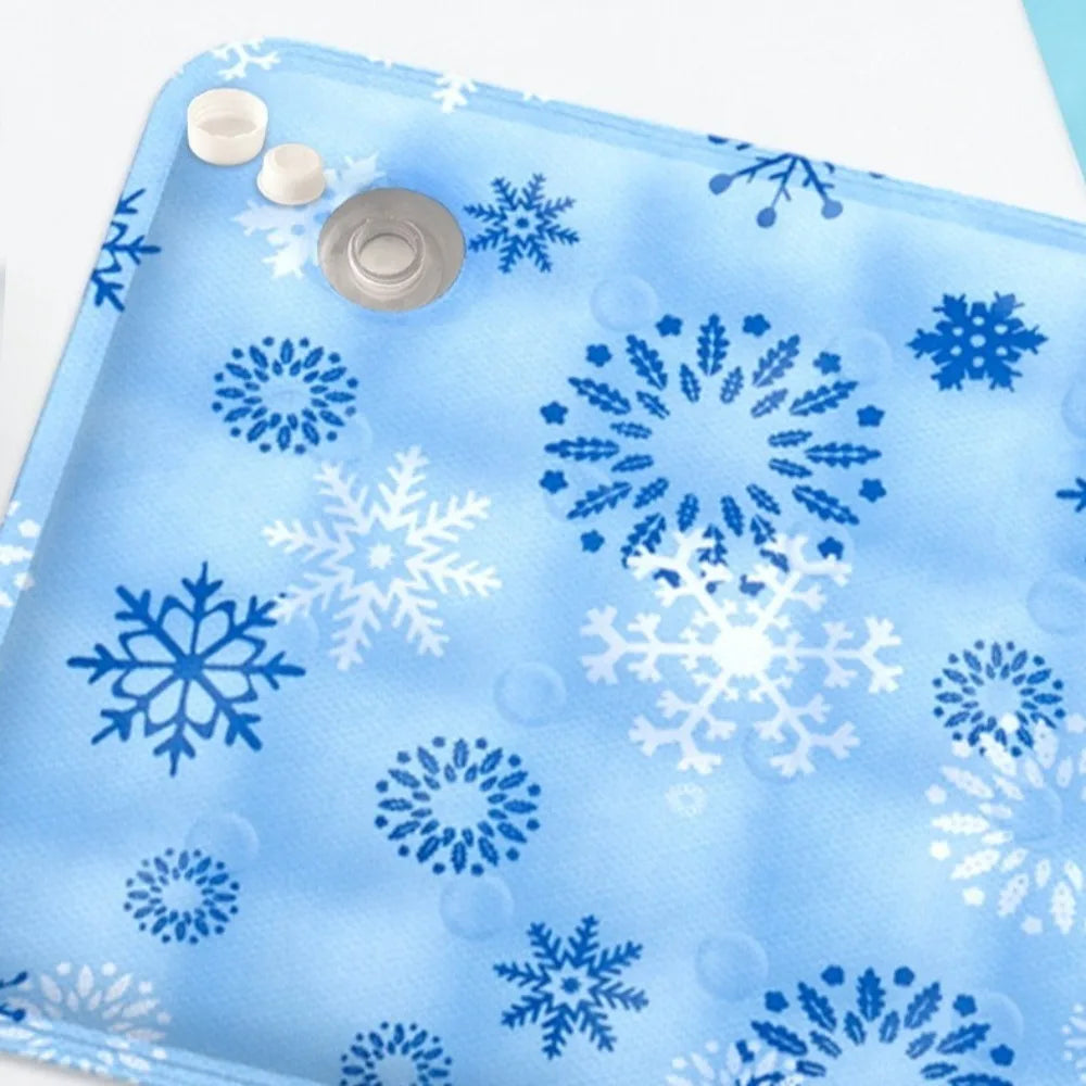 Blue ice pack with snowflake patterns on a white background
