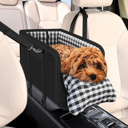 Dog in a car seat cover with checkered pattern in a vehicle
