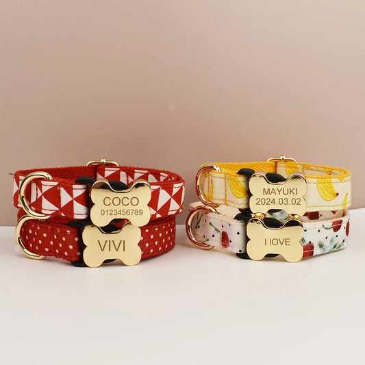 Two dog collars with bone-shaped tags displaying names and dates on a beige background.